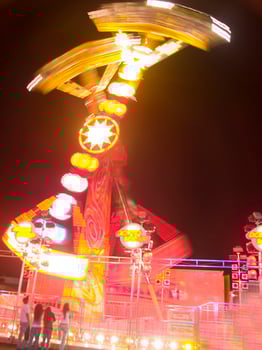 view of a funfair at night photo