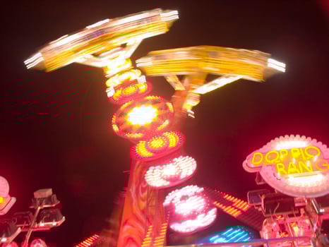 view of a funfair at night photo