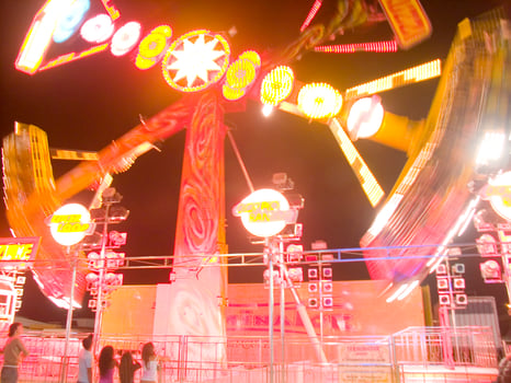 view of a funfair at night photo