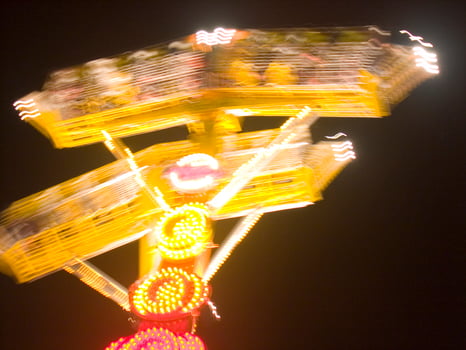 view of a funfair at night photo