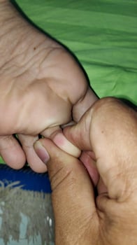 Young woman having foot massage in beauty salon, close up view photo