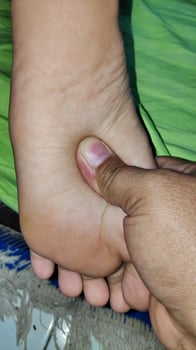 Young woman having foot massage in beauty salon, close up view photo