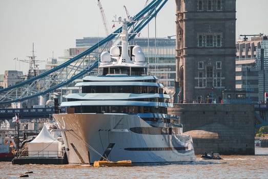 Cruise ship moored on Thames river with Tower bridge in background photo
