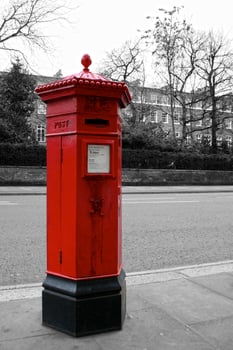 Color isolated Victorian hexagonal red post box of the Penfold type in London photo