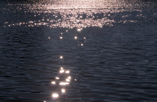 a boat is in the water at sunset photo