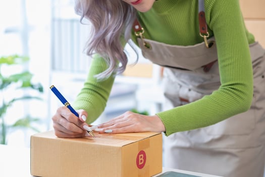 SME Small Business Entrepreneur, Asian Young Woman Smiling Fresh Face Preparing Orders for Customers Packing Delivery Boxes, Work From Home Online, E-commerce. photo