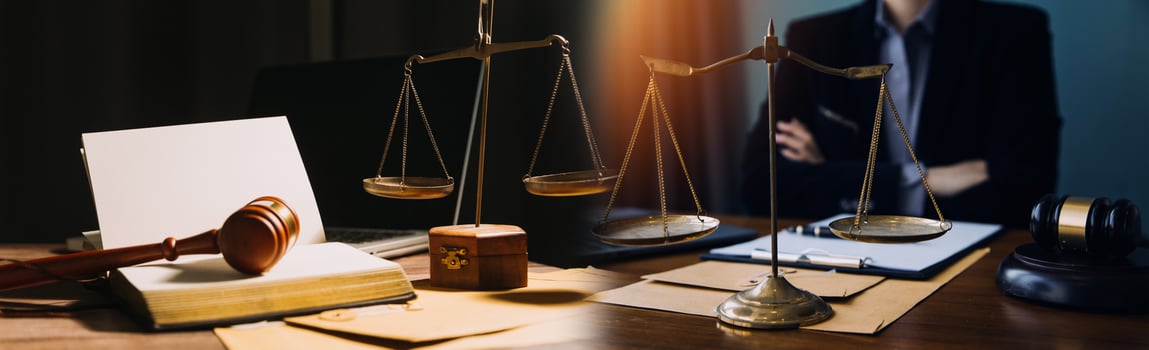 Business and lawyers discussing contract papers with brass scale on desk in office. Law, legal services, advice, justice and law concept picture with film grain effect photo