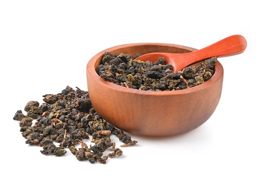 Chinese oolong tea Tie GuanYin  isolated on white background. photo