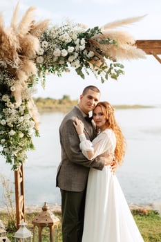 wedding ceremony of the newlyweds in a country cottage photo