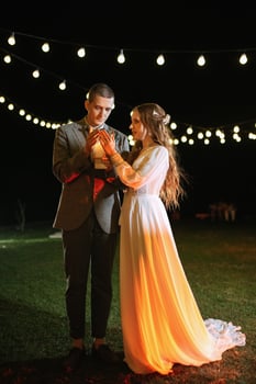 transfer of wedding fire with the help of candles the newlyweds photo