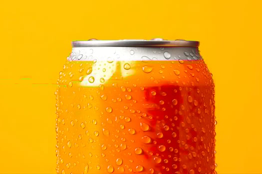 Can of fresh soda with water drops on orange background, closeup. Generative AI photo