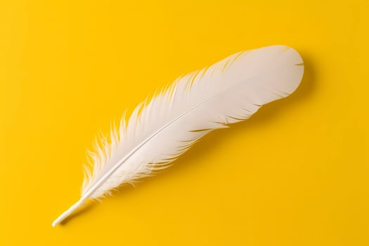 Close up of bright white feather. Copy space, yellow background. Fashion and Party concept. AI Generative photo