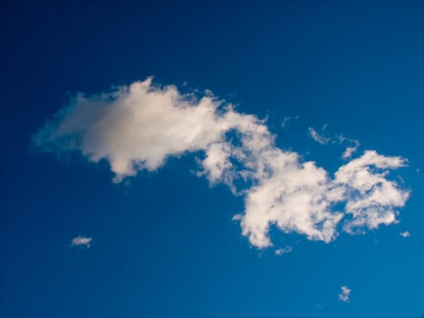 a jet plane flying through a cloudy sky photo