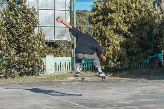 Asian teens skateboarding in the Park. Indonesia. August 02, 2023 photo