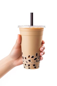 A hand holding takeaway plastic cup of delicious iced bubble milk tea and black pearls isolated on white background. ai generated photo