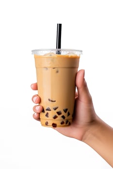 A hand holding takeaway plastic cup of delicious iced bubble milk tea and black pearls isolated on white background. ai generated photo