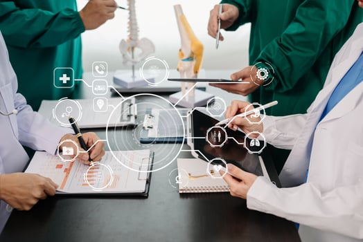 Medical technology network team meeting concept. Doctor hand working with smart phone modern digital tablet and laptop computer with graphics chart interface, with virtual icon photo