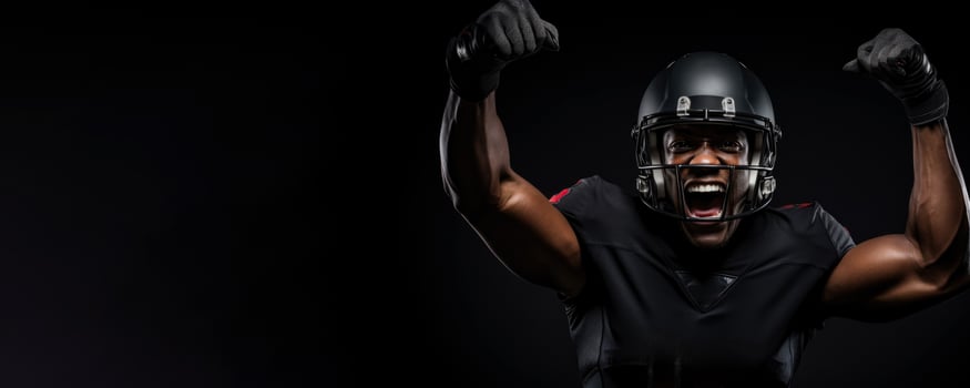 American football player celebrating a game-changing interception on black background with empty space for text photo