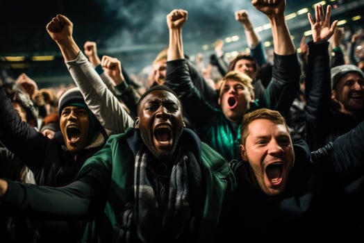 American football followers euphoric after a game-winning field goal photo