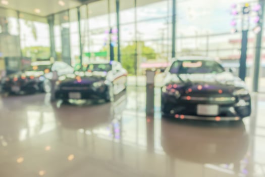 new cars in showroom interior blurred abstract background photo