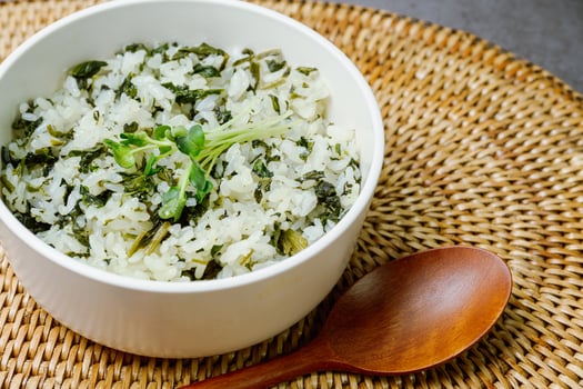 Gondeurenamulbap, Korean style Thistle Rice, Made with dried gondeure, a fragrant, wild mountain plant, which is soaked in water and squeezed photo