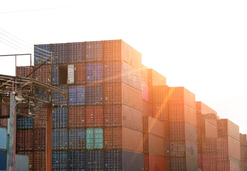 A large number of shipping containers are waiting to be transported. photo