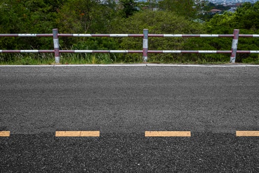 Rural road with stiles marking lines white stripes texture Background. photo