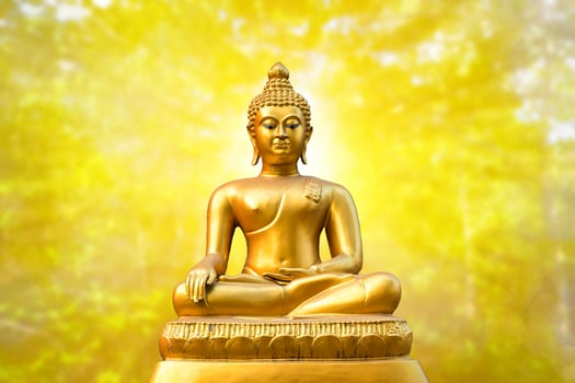 Beautiful of Golden Buddha statue on golden yellow bokeh background. photo