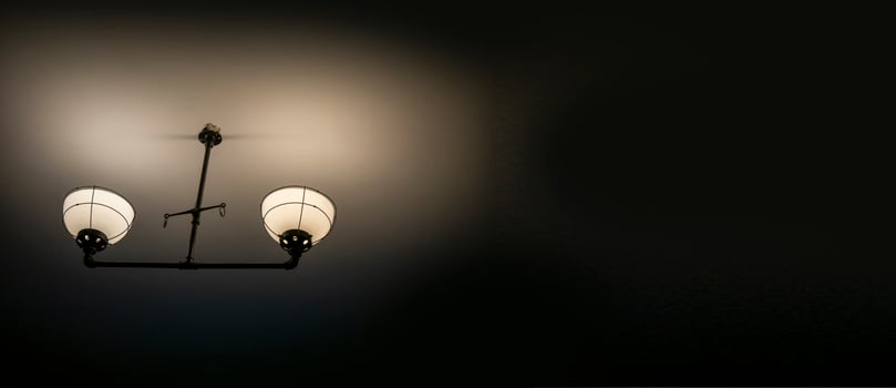 Old ancient lamps on the wall in a dark room background, gloomy light photo