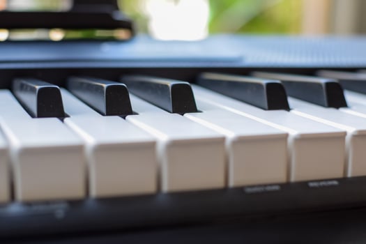 Close-up of piano keys. Piano black and white keys and Piano keyboard musical instrument placed at the home balcony during sunny day. photo