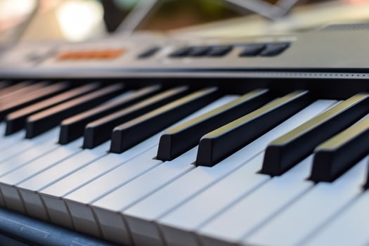 Close-up of piano keys. Piano black and white keys and Piano keyboard musical instrument placed at the home balcony during sunny day. photo