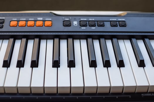 Close-up of piano keys. Piano black and white keys and Piano keyboard musical instrument placed at the home balcony during sunny day. photo