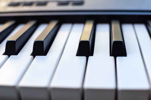 Close-up of piano keys. Piano black and white keys and Piano keyboard musical instrument placed at the home balcony during sunny day. photo