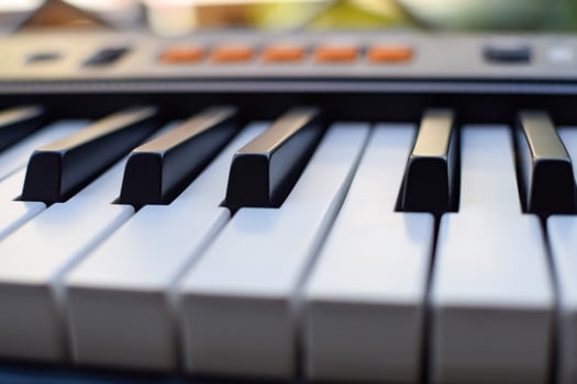 Close-up of piano keys. Piano black and white keys and Piano keyboard musical instrument placed at the home balcony during sunny day. photo
