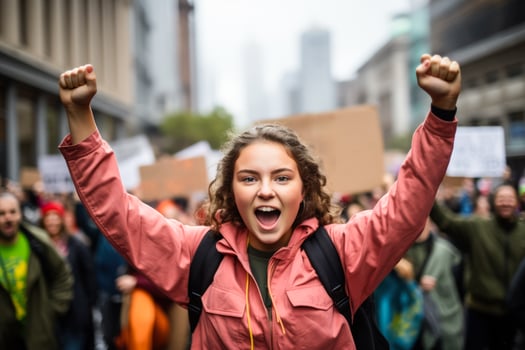 A determined activist holding a Save Our Planet sign at a climate change strike surrounded by a sea of passionate protesters photo
