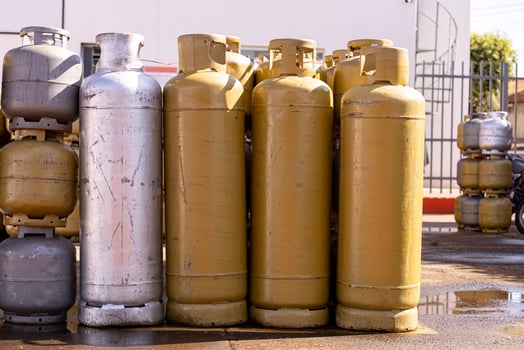 pile of kitchen gas cylinders photo