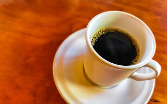 Cup of americano black coffee in restaurant Mexico. photo