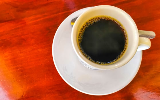 Cup of americano black coffee in restaurant Mexico. photo
