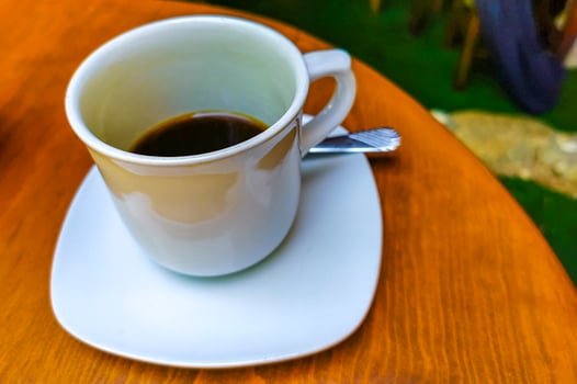 Cup of americano black coffee in restaurant Mexico. photo