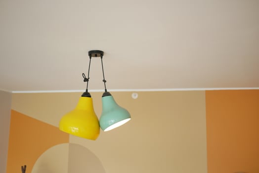 gray ceiling lamp hanging in a room , photo
