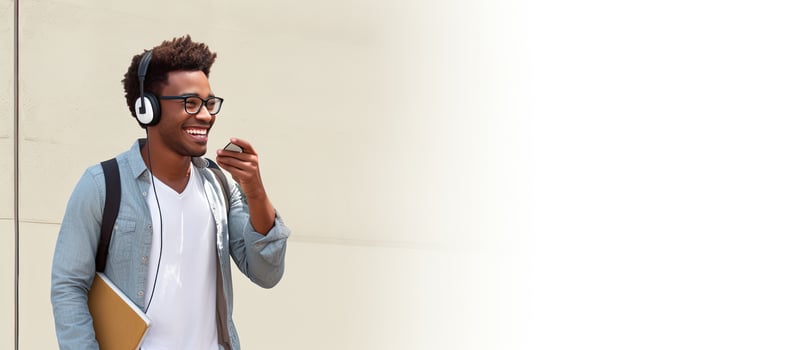 African American guy walking and talking on a phone with a smile photo
