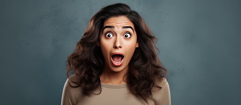 Surprised Hispanic woman gesturing upwards with both hands indicating empty space photo