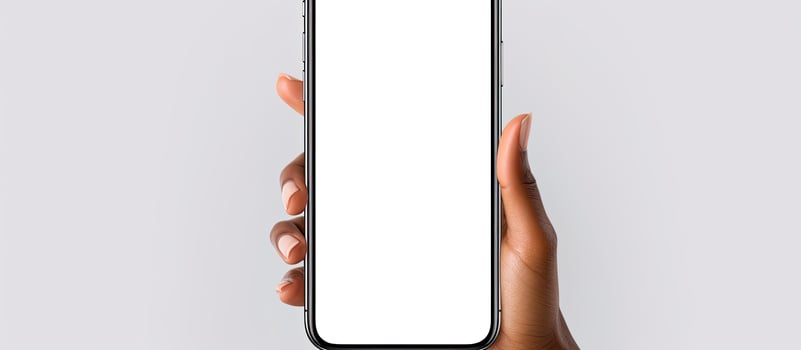 Women s hands holding cell phone with empty screen isolated photo