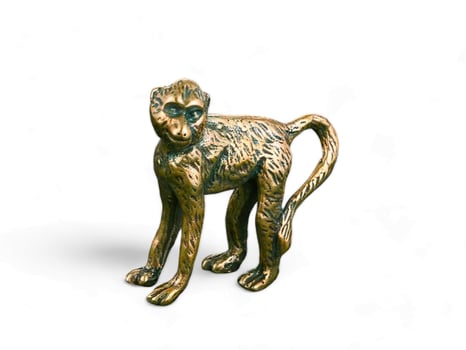 Monkey gold color animal statue on white background photo