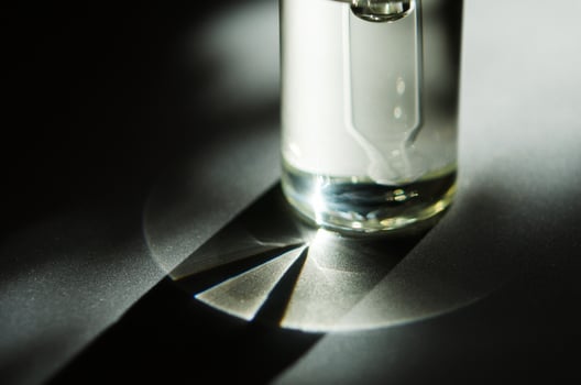 Cosmetic or medical glass bottle with pipette. Skin care concept. Natural hard light, deep shadows. - Image photo