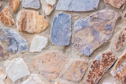 The walls are made of natural stone. background, texture. Close-up background. photo