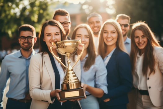 Business leader with winning cup photo