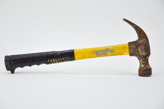 black yellow hammer on a white background photo