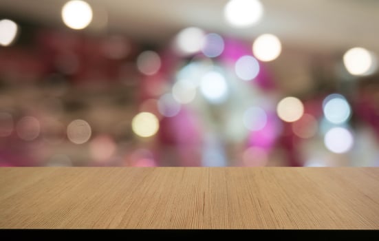 Empty wooden table in front of abstract blurred background of coffee shop . can be used for display or montage your products.Mock up for display of product photo