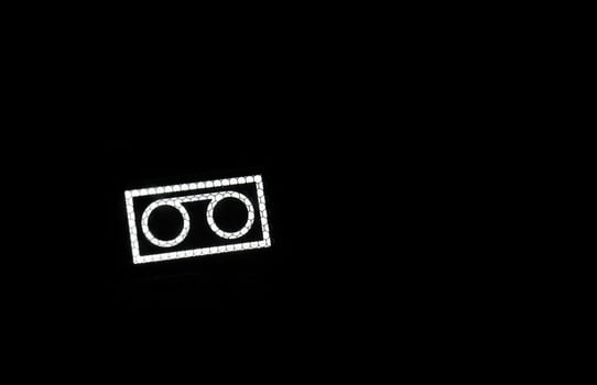 Videotape icon on black photo
